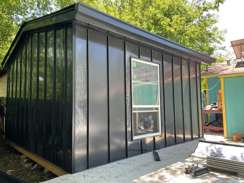 Black standing seam metal wall panels for Roof Inspection in Semmes