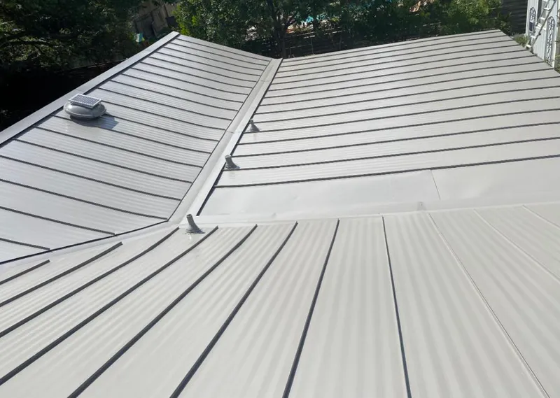 Solar attic fan installed on a metal roof for Roof Ventilation in Semmes